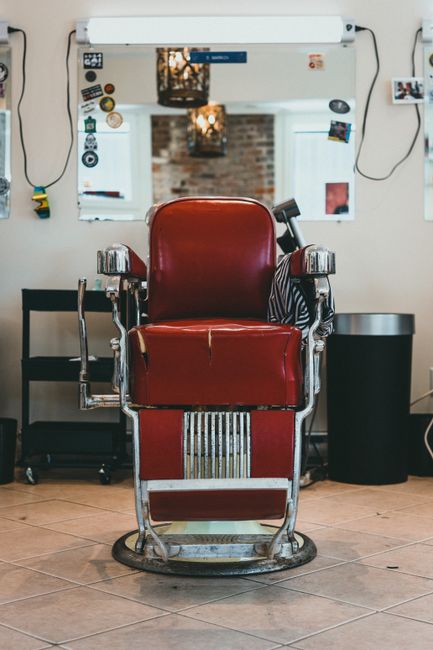 Classic vintage red leather barber chair